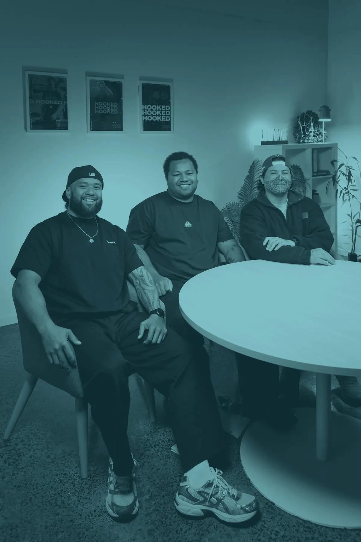 The three Hooked speakers laughing together at the table — Montel Tivoli on the left.